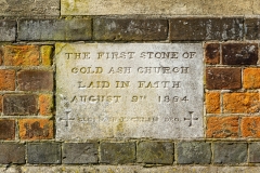 Stone, in laid within the brick of the church wall. It reads "The first stone of Cold Ash Church. Laid in faith, August 9th 1864."